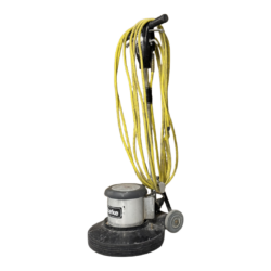 A commercial floor buffer with a metal base, black and gray body, handle, and a yellow coiled power cord, standing upright on wheels.