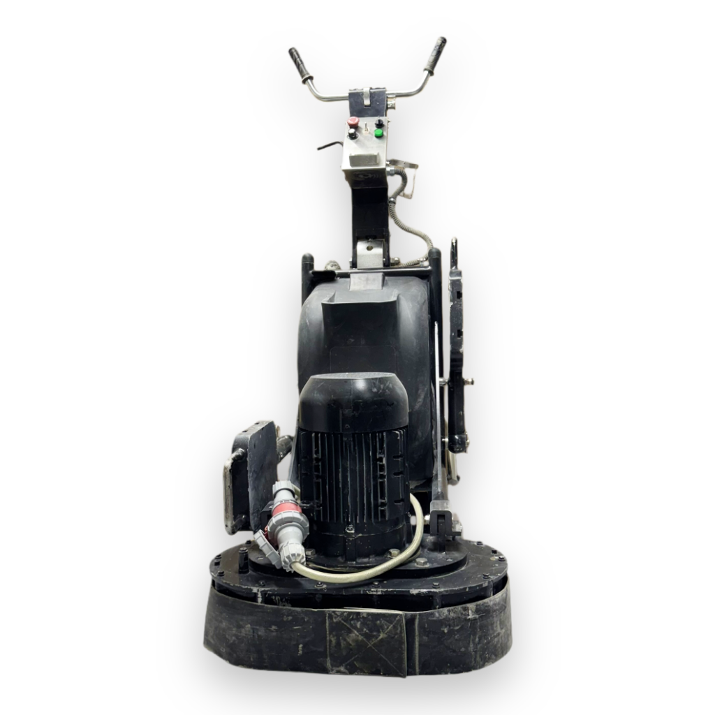 Front view of a heavy-duty industrial floor grinder with control handles, power cable, and a large base for grinding surfaces.