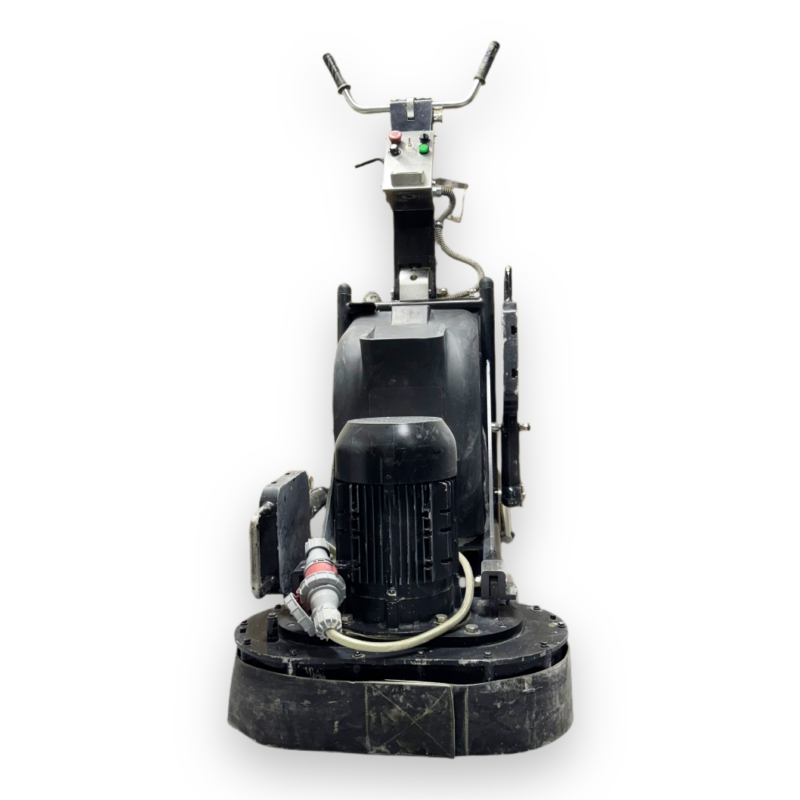 Front view of a heavy-duty industrial floor grinder with control handles, power cable, and a large base for grinding surfaces.