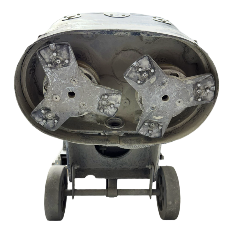 Close-up of the underside of the Maverick Triton Twin Screw Grinder, featuring two rotating brush heads and wheels, isolated on a white background.